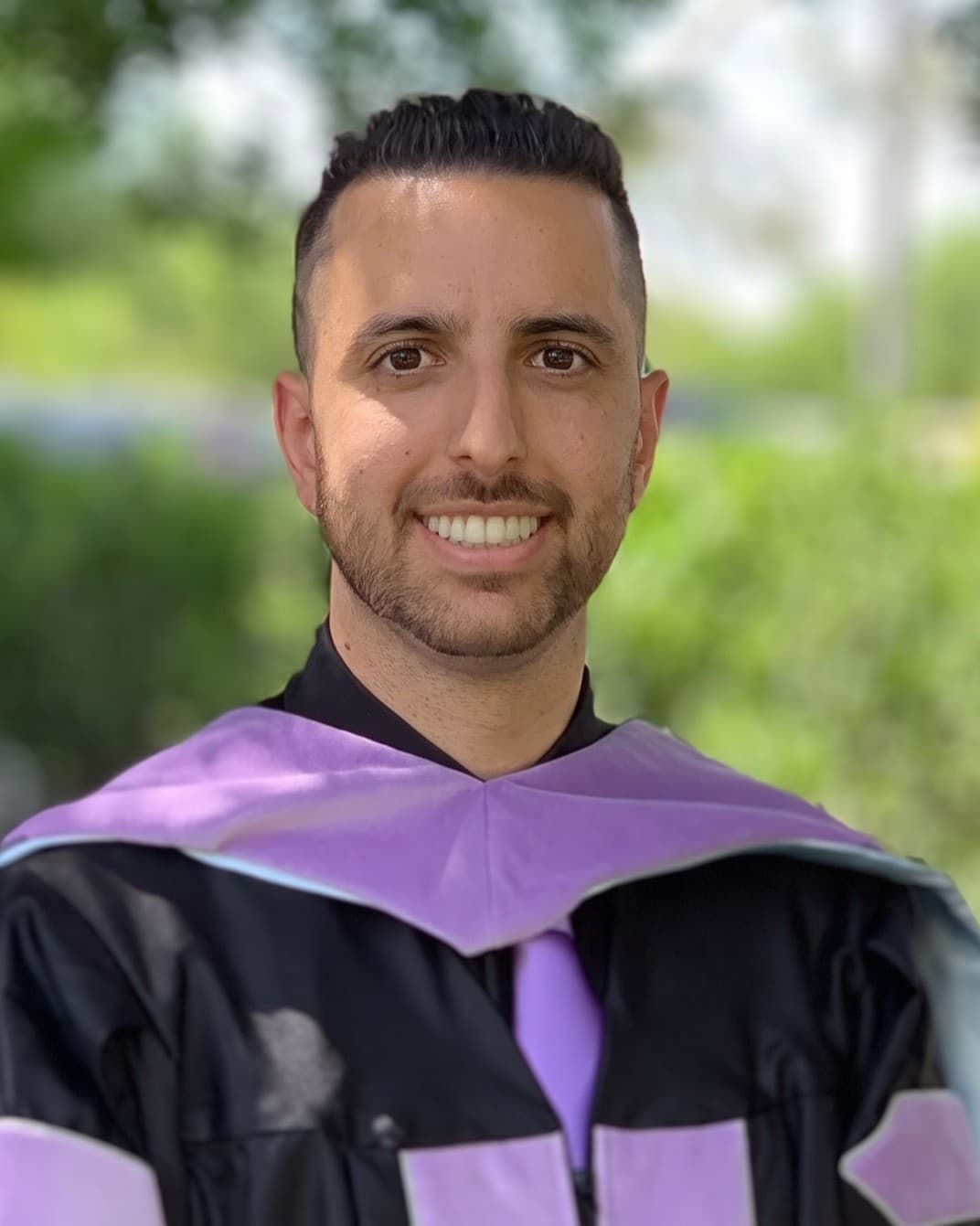 Dr. Mario Amidi in his dental school graduation gown, 2019
